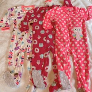 New Without Tags! Three Carter’s 18 mo fleece footie pajamas. New without tags.